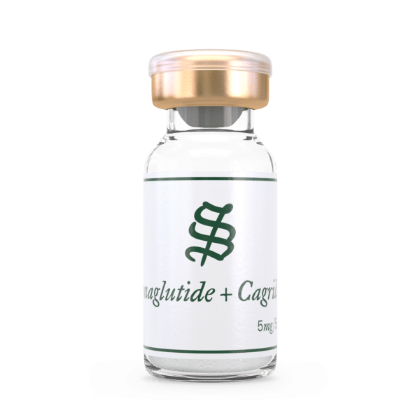 A small clear glass vial with a gold cap, labeled Semaglutide / Cagrilintide 5mg in green font, rests on a plain white background.